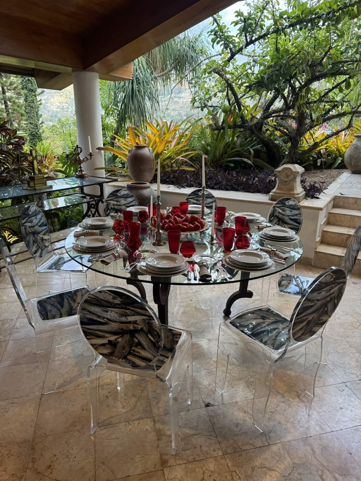 Glass table with red goblets